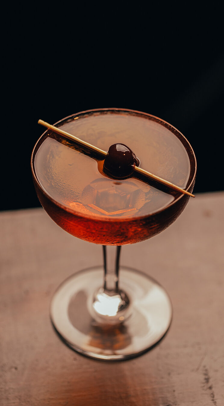 A drink with cherries